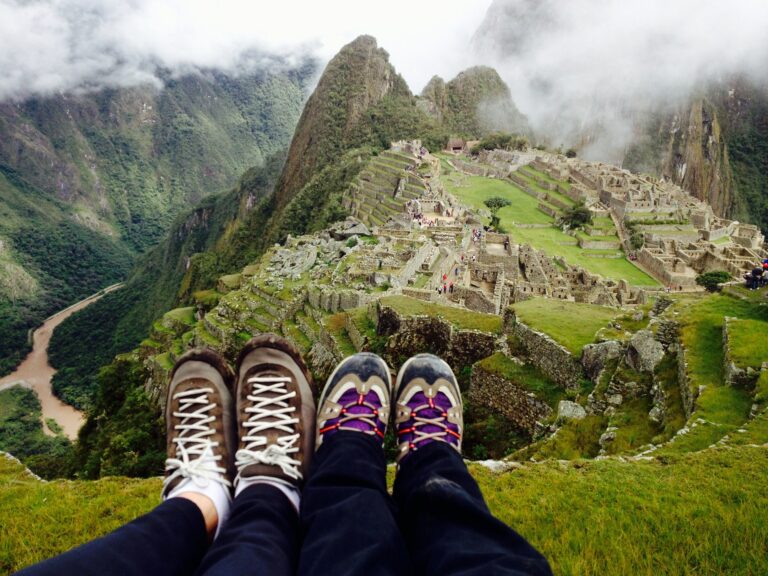 Couple with shoes overlooking mountain