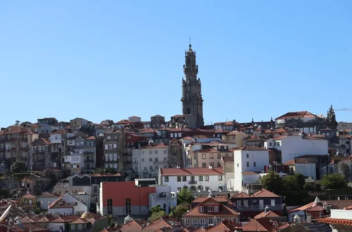 First-time visitors overlooking a historic European city at sunrise
