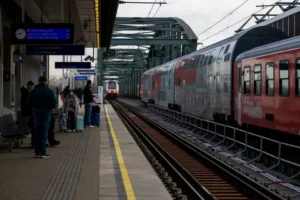 Travelers boarding a high-speed train in Europe